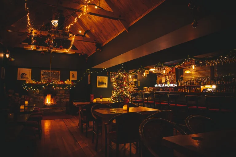 Cosy pub interior with fireplace and Christmas decorations in Strandhill