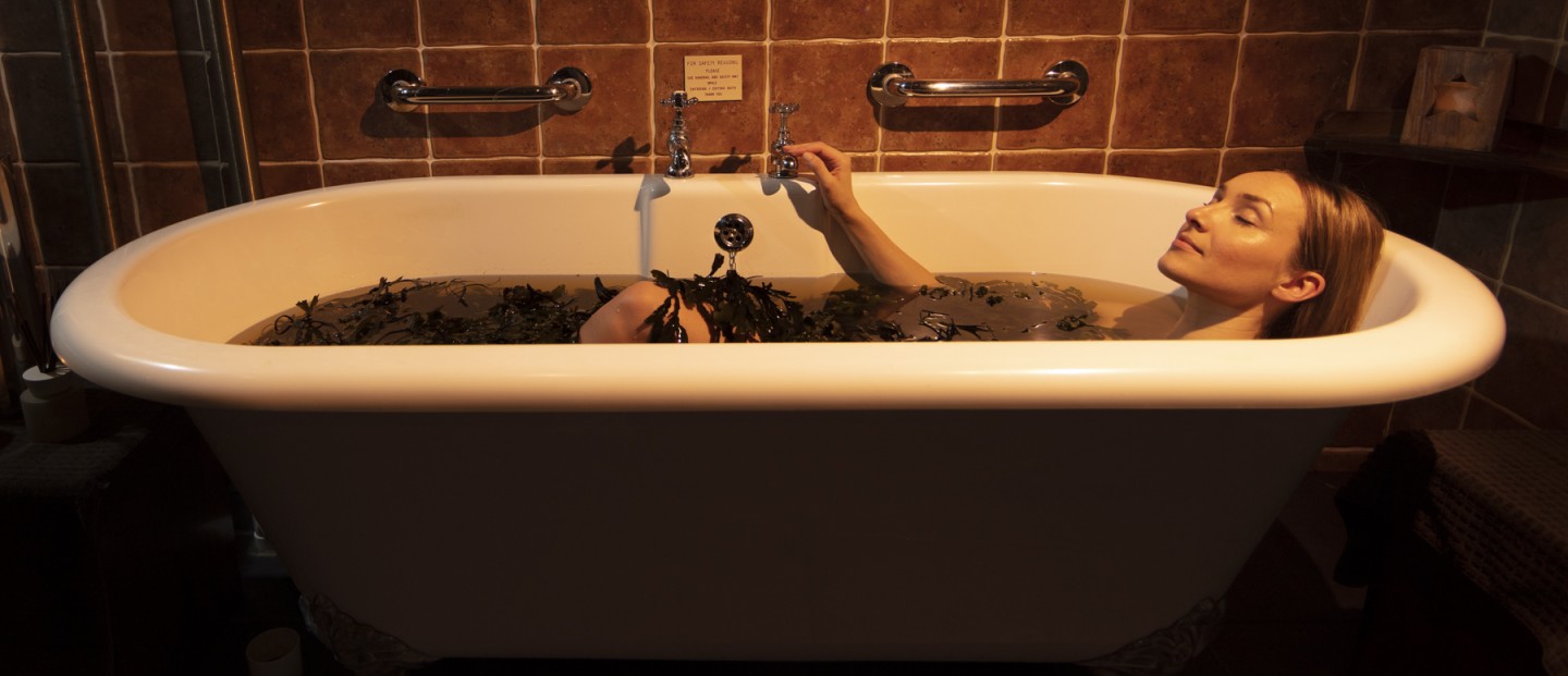 A woman enjoying A voya seaweed bath