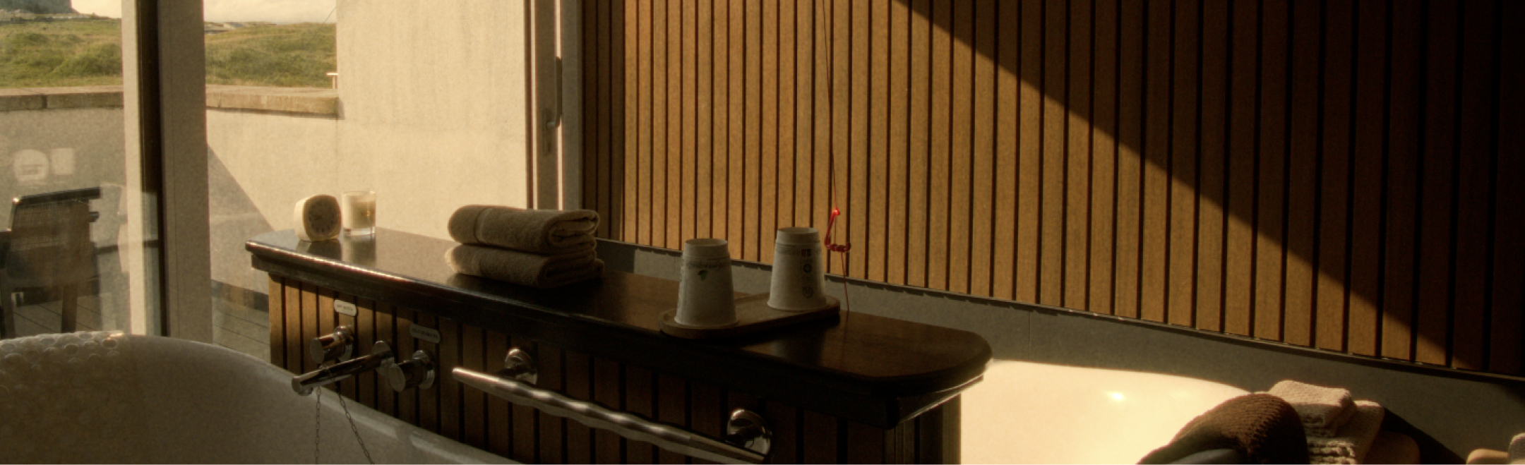 A bathhouse room with a scenic view