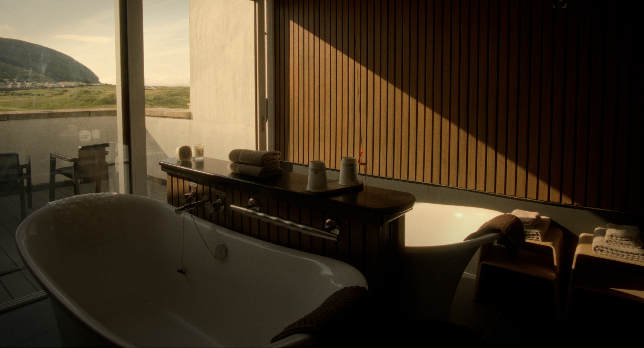 One of Voya's bathhouse rooms with a scenic view