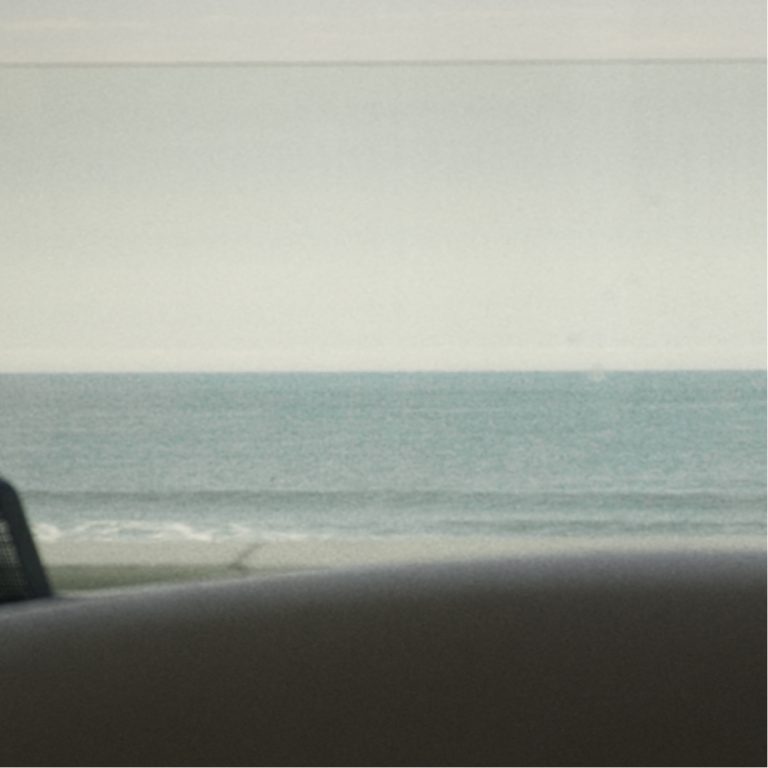 View of the Atlantic coast through a car window near Strandhill