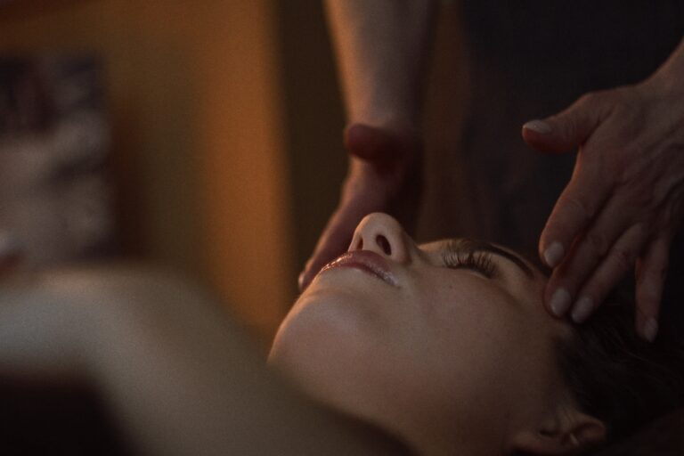 A woman receives a facial at VOYA spa