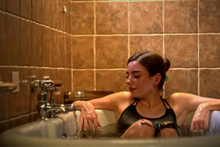 A woman in a bathtub enjoying a seaweed bath