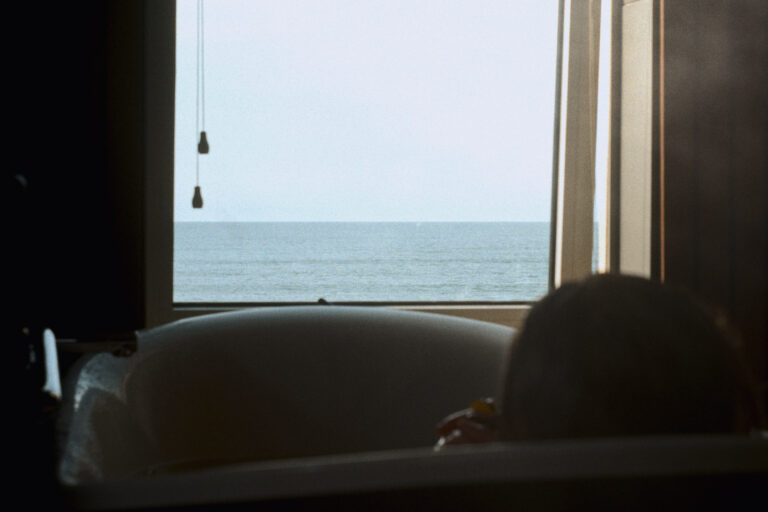 A person enjoys the views from their bathtub at VOYA